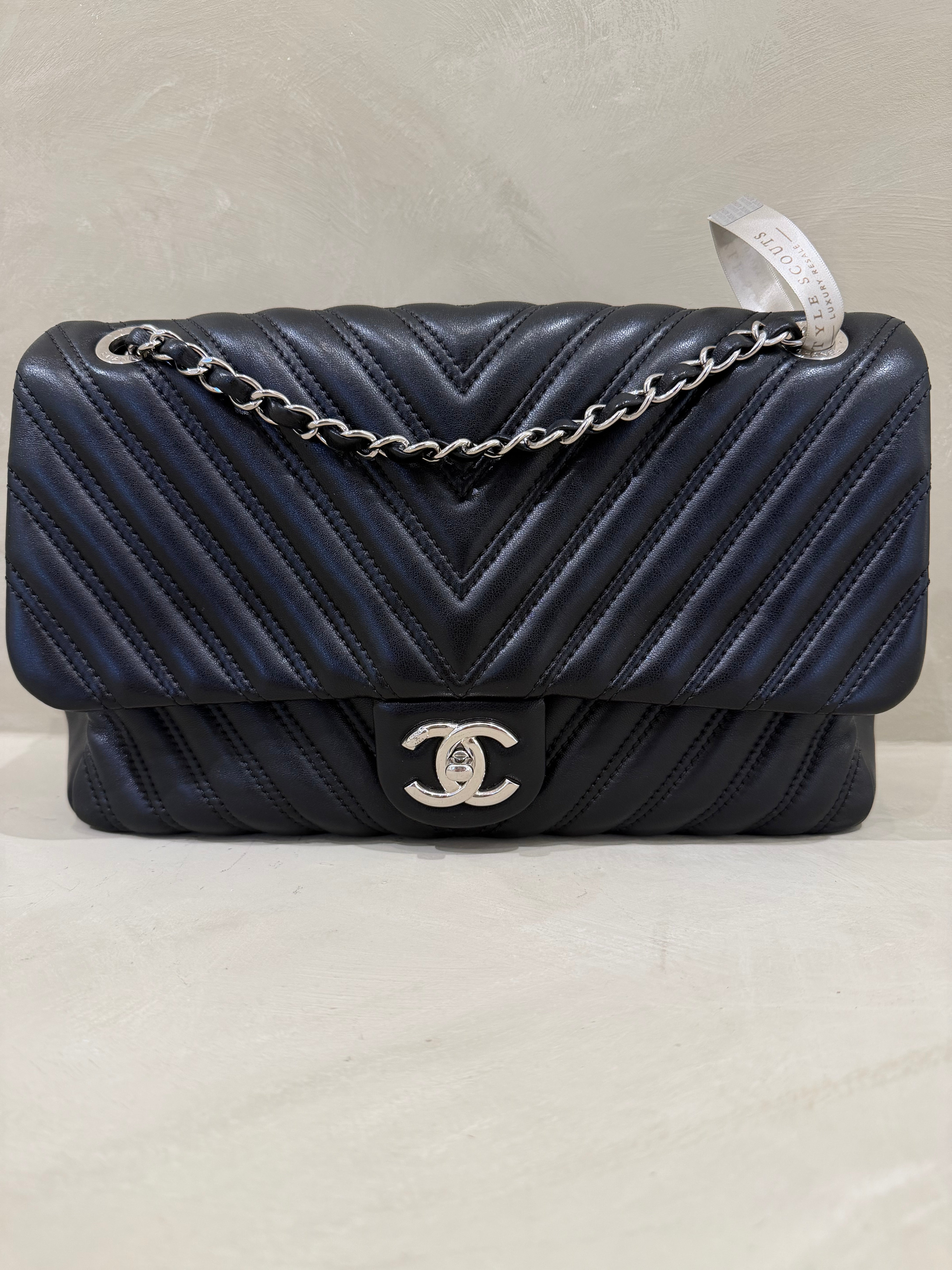 Black Chanel Seasonal Jumbo lambskin leather flap bag with silver hardware