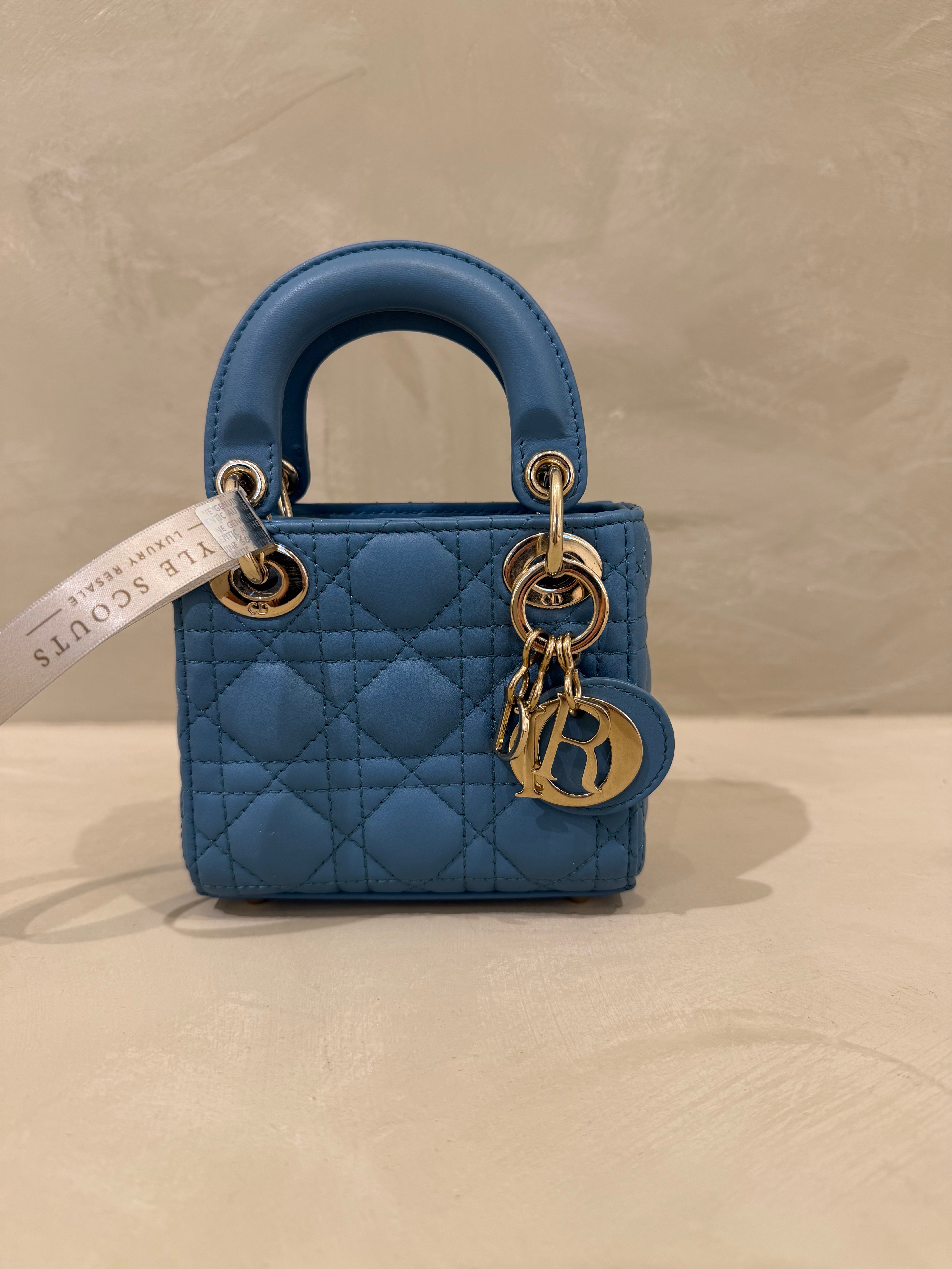Dior Lady Micro Mini blue lambskin leather handbag with gold hardware and leather strap