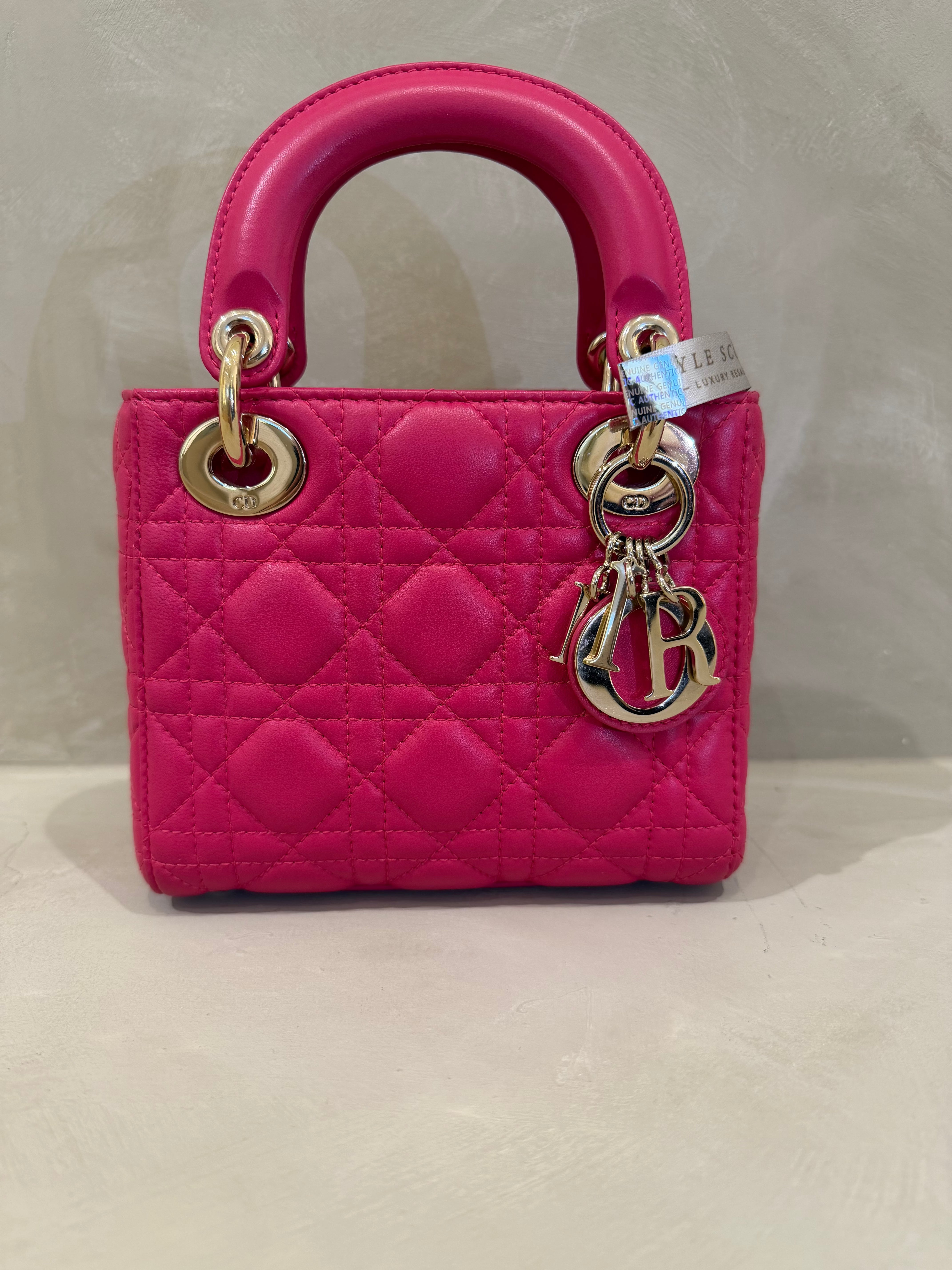 Lady Dior Mini bright pink lambskin handbag with light gold hardware